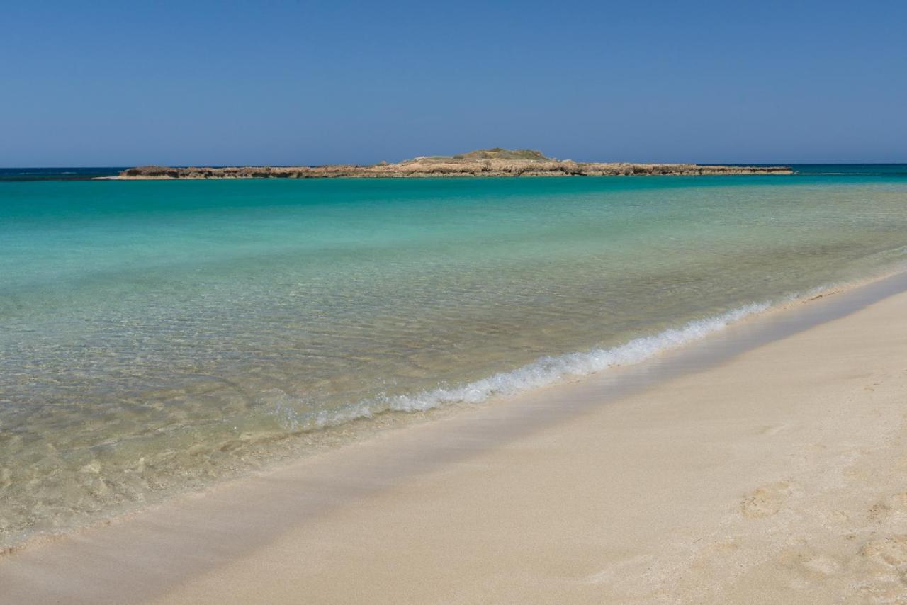 カポ ベイ ホテル プロタラス エクステリア 写真 The beach at the bay of Agia Marina