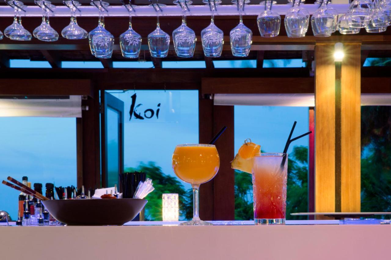 カポ ベイ ホテル プロタラス エクステリア 写真 The bar at the Koi restaurant